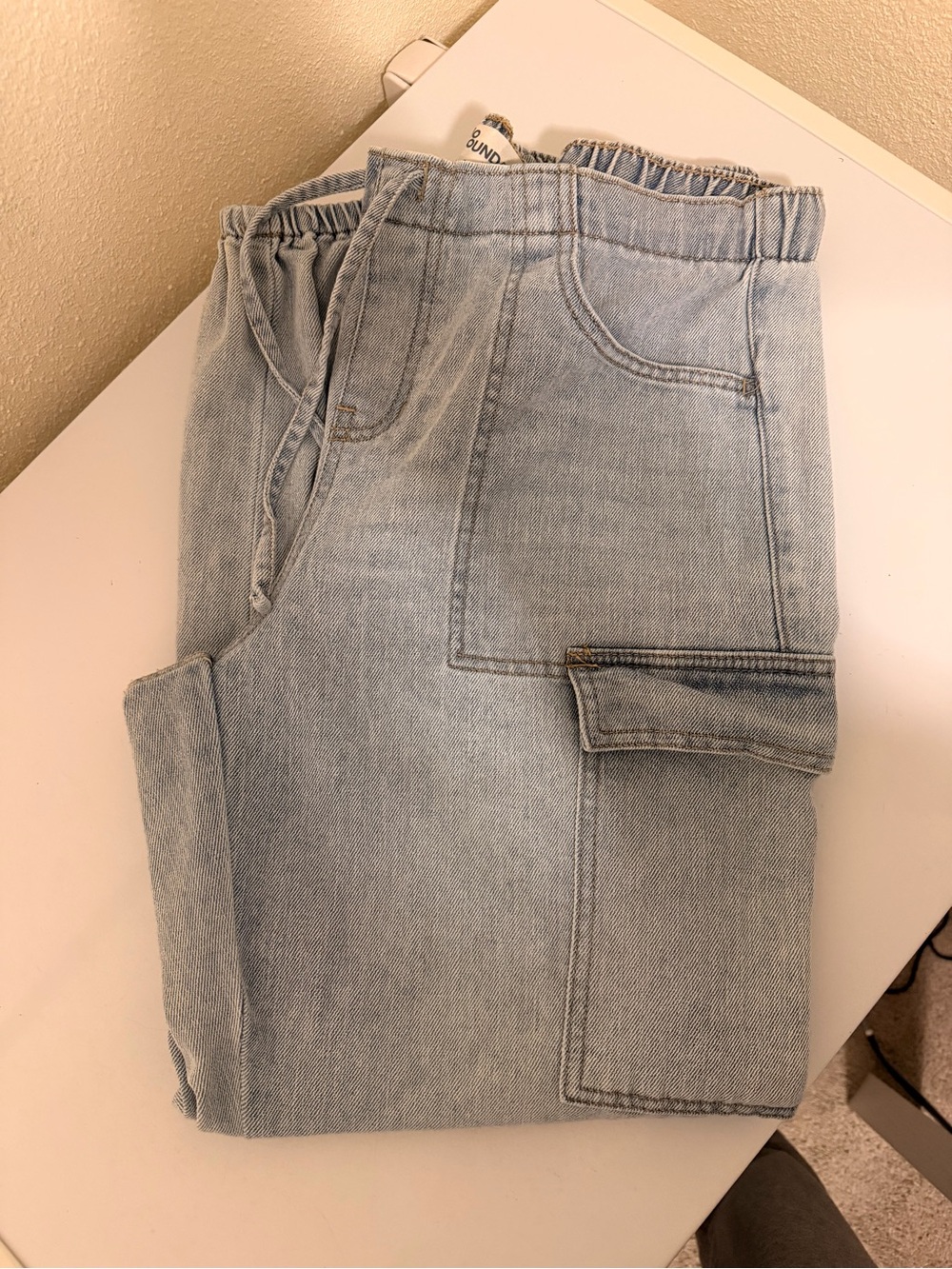 Women's Light Wash Denim Cargo Jeans. Size large.